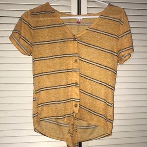 woman’s yellow striped blouse